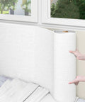Easy Peel And Stick White Wallpaper Roll With 5mm XPE Foam Thermal Insulation waterproof soundproof linen texture being applied.