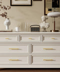White dresser with Gold Cabinet Handles 10 Pack Brushed Gold Stainless Steel Drawer Pulls For Kitchen Cabinets And Dressers Durable DIY Upgrade 10 Inch Center To Center 256mm 32mm Projection 12mm Diameter, decorative items on top.