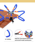 Six Flexible Arm Helping Hands Soldering Station With Silicon Clip Tips clamped on a wooden table.