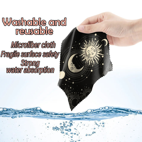 Front view of black microfiber glasses cleaning cloth, 6.3x6.3 in, sun and moon print; for eyeglasses, phones, cameras.