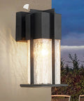 Dusk To Dawn Exterior Wall Light With Crackle Glass Sensor mounted on wall, illuminating outdoor space, waterproof black finish.