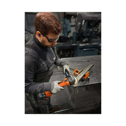 User operates Compact Cordless Angle Grinder With Brushless Motor And 18 Volt Battery Compatibility, cutting metal with sparks flying.