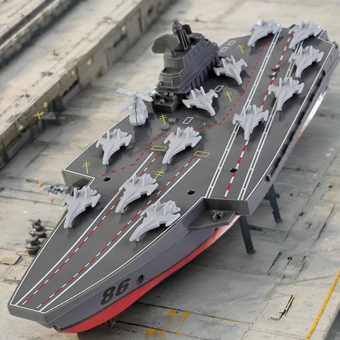 Remote Controlled Warship Battleship And Aircraft Carrier RC Boat With 4WD Dual Motors And 2.4G Radio Speeds Up To 10 Kmh Great For Lakes And Pools Ideal For Exhibits Or Military Model Collectors Beginner Friendly For Ages 14 And Up on a model runway with miniature aircraft.