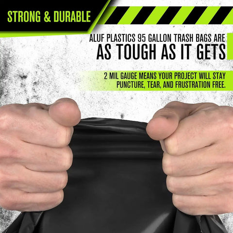Close-up of hands gripping Heavy Duty 95 And 96 Gallon Garbage Bags 50 Pack With Bulletproof 2 Mil Thickness showing durability.
