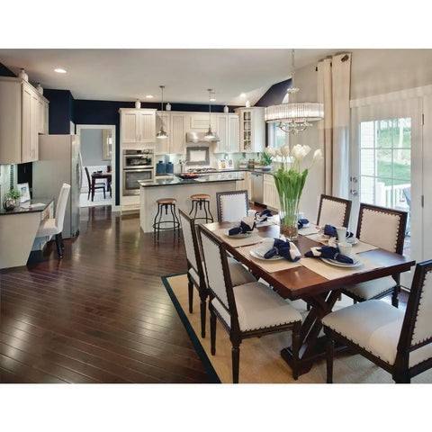 Modern kitchen with One Light Fresnel Glass Coastal Pendant in Brushed Nickel, island seating, and dark wood flooring.
