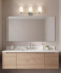 Sleek 3 Light Vanity Light With Satin Etched Opal Glass And Clear Glass Accents In Brushed Nickel Finish above bathroom mirror