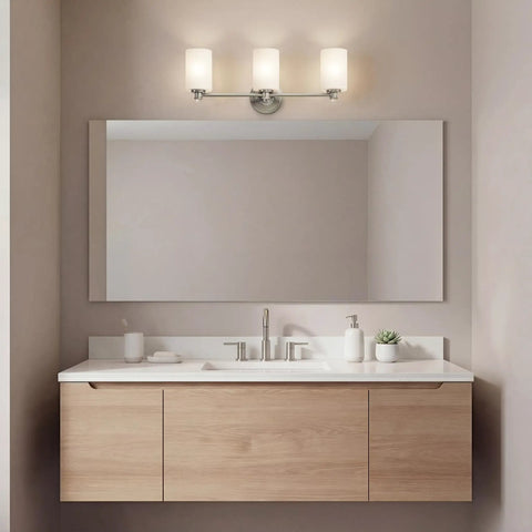 Sleek 3 Light Vanity Light With Satin Etched Opal Glass And Clear Glass Accents In Brushed Nickel Finish above bathroom mirror