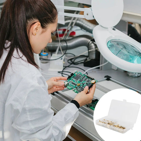Woman inspecting a PCB with Real Deal M3 Brass Hex Standoff Screw And Nut Assortment Kit For PCB Circuit Boards Mounting Hardware.