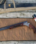 Gun Scrubber Cleaner 15-ounce aerosol with shotgun and cleaning tools on wooden surface