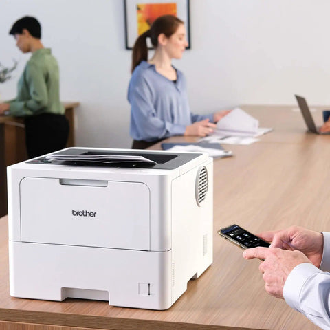 Office Printing Powerhouse Fast 50 Pages Per Minute Monochrome Laser Printer With Wireless Networking And Duplex Auto-Printing on desk