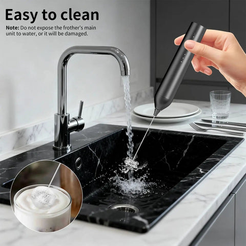 Rechargeable Handheld Milk Frother With Stand For Coffee Lattes Cappuccinos Matcha And More Quiet Fast Foam Wand In 15 To 30 Seconds USB Rechargeable Kitchen Gift Black being washed under tap water in a kitchen sink.
