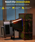 Side view of LP5 20W Dual Laser Engraver And Cutter Pro Grade with metal accents, positioned next to a vintage-style suitcase.