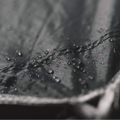 Close-up of waterproof ripstop nylon with taped seams, part of a Waterproof Hammock Rain Fly Tarp With Stakes And Carry Bag for camping.