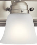 Close-up of Brushed Nickel 5 Light Vanity Bath Light With Clear Satin Etched Glass Dope Modern 36 Inch Wall Mount Fixture.