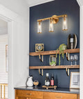 Brushed Gold 3 Light Vanity Light Fixture for Bathroom and Hallway Brass Bath Lighting with Glass Cylinders on dark wall