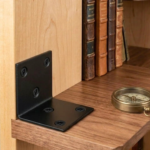 Rock Solid Built Tough Heavy Duty Black Stainless Steel L Brackets 4 Pack Wall Mount Shelf Supports For Furniture Wood Shelving Rustproof Workhorse For Kitchen Cabinets And Vanities Prime Grade Hardware on a wooden shelf.