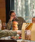 Family dinner with 100 Pack Large Paper Bread Bags With Tin Tie Tab Lock Clear Front Window showcasing sourdough bread