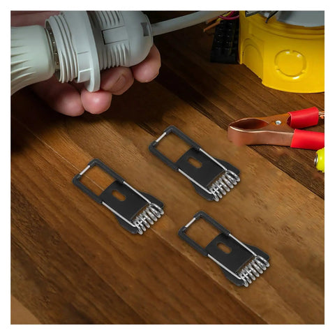 Close-up of Tough As Nails Spring Clips For Ceiling Light Fixtures And Lamp Mounting Hardware on wooden surface