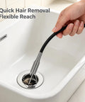 Heavy Duty Flexible Drain Clog Buster With 63 Inch Spring Steel Plumbing Snake in a sink removing hair and gunk.