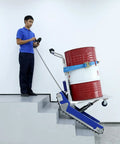 Heavy Duty Powered Electric Track Stair Climber Hand Truck Dolly with Joystick moving a barrel down stairs safely.