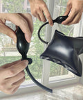 Air Wedge Pump Pro Grade For Cars And Home Projects, Adjustable Auto Leveling Shim Bag with hand inflating near window