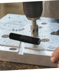 Hydraulic Tool Kit With Punch Driver And Die Set for metal sheets and conduit, close-up of punching process in workshop