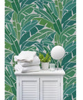 Heavy Duty Tropical Leaf Exotic Textured Vinyl Wallpaper, Slick Leather Finish Wall Covering For Walls, with towels and plants.