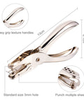 Close-up of gold tone hole punch from 300 Pieces Three Quarters Inch Paper Fasteners Small Round Metal Brads With Hole Punch Included
