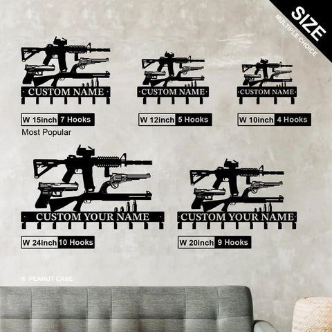Gun Theme Wall Hooks For Keys And Clothes Personalized Cast Iron Key Holder And Coat Hanger In Matte Black displayed on wall