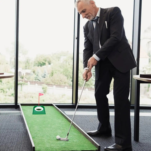 Man using Six Pack Golf Putting Cups With Flags, Plastic Mini Golf Hole Practice Aids For Adults indoors