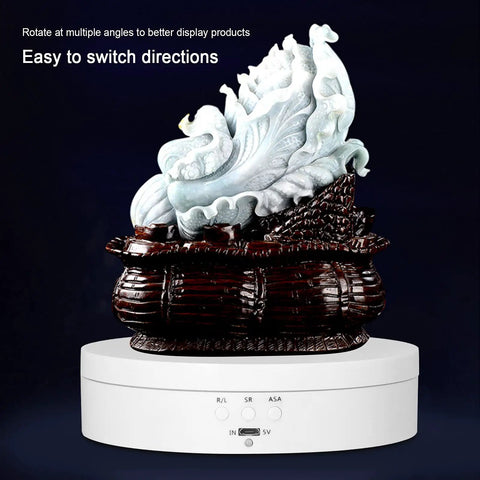 Smooth Motorized Electric Display Turntable For Jewelry And Watches Features 360 Rotating Base With Silent Operation Adjustable Speed Control Durable ABS Build showcasing a decorative piece.
