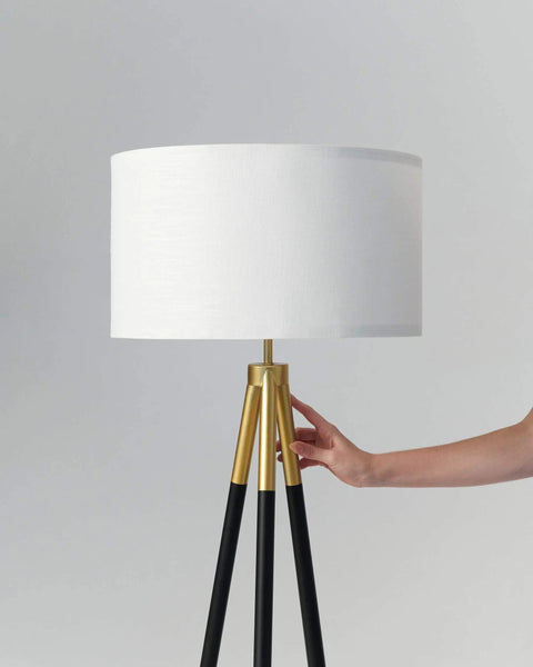 Levi LED Floor Lamp With Tall Black And Gold Tripod For A Dope Living Room Vibe, featuring a white linen drum shade