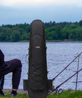 Long Fins Bag For Scuba Gear And Snorkel Kit next to a lake with fishing rods, showing wet dry separation feature.