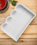White plastic Fence Concrete Mold For DIY Projects, Garden Brick Mold, on wooden table for patio paving and walkways.