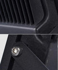 Close-up of JUDYSSY Solar Flood Lights Led Solar Floodlight's die-cast aluminum housing, showcasing heat dissipation fins.