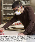 Person using a sander, wearing Small N95 Particulate Respirator Mask With Adjustable Nose Clip And Two Strap Design, Electrostatic Media, Nose Foam, Disposable, Pack Of 20, NIOSH Approved For Dust And Smoke Protection