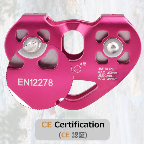 Close-up of pink Beefy 30 KN Zipline Pulley Tandem Dual Trolley Kit showing CE certification for heavy duty rigging.