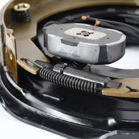 Trailer brake magnet kit, 12-inch, close-up showing gray magnet, coiled spring, and wiring.