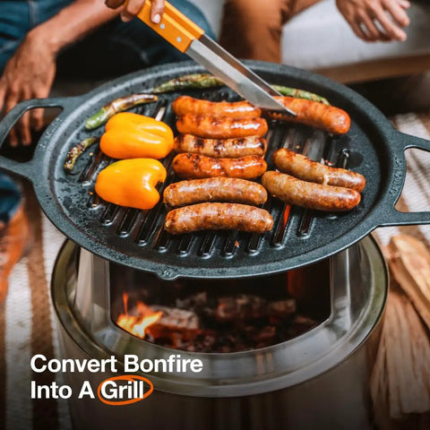 Bonfire Grill Top And Hub Cast Iron Cooktop With Stainless Steel Hub grilling sausages and peppers over fire pit