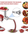 Installed metal meat grinder attachment for KitchenAid stand mixer with 4 grinding plates, 3 sausage tubes, 2 blades.