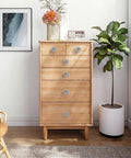 Wooden dresser with crystal cabinet knobs set with glass doorknobs and chrome base, sparkling drawer pulls in a room setting.
