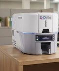 Heavy Lift Double Sided ID Card Printer With 300 Dpi Crisp Resolution And Lightning Fast Two Hundred Twenty Five Cards Per Hour Output on a desk.