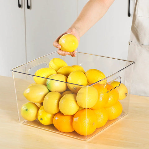 Extra Large Clear Plastic Storage Bins 4 Pack 11x11 Cube Organizer Squares With Handles For Pantry Closet Kitchen Bathroom Under Sink And Laundry Room See Through Durable Stackable Storage Containers For Clutter Busting Organization filled with lemons and oranges