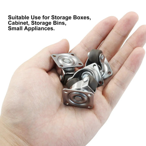 Hand holding 8 Pack Tiny Swivel Caster Wheels 1/2 Inch Diameter Low Profile Self Adhesive Steel Top Plate For Small Appliances Quiet Rollers Floor Safe Durable Rubber Wheels