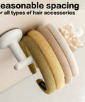 Suction Cup Headband Holder And Wall Mounted Hair Accessory Organizer Keeps Your Bathroom Vanity Looking Fly With This Hassle Free No Drill Scrunchie Storage Rack In Crisp White showcasing multiple hair accessories on a suction cup holder.