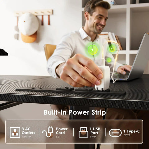 Person using built-in power strip on 55 Inch L Shaped Electric Standing Desk With Keyboard Tray And Reversible Height Adjustment