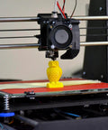 3D printer creating yellow owl figure, showcasing process for using Knurled Insert Nuts, 25pcs M6 x 5mm L x 8mm OD for secure embedding.
