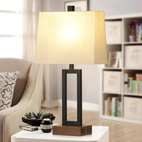 Set Of 2 Modern Bedside Lamps With USB Ports And AC Outlet 23.5 Inch Tall Wood Base With Linen Shade shown on living room table