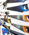 Rock Solid And Built Tough 80 Piece Peg Board Hooks And Bins Set For Garage Tool Storage Wall Mount Organizer With Steel Pegs showing saws on a pegboard.