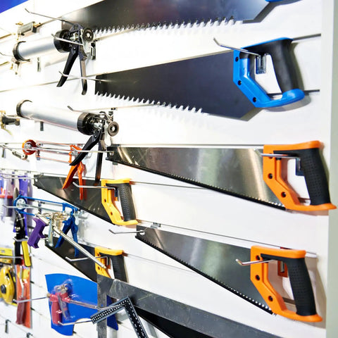 Rock Solid And Built Tough 80 Piece Peg Board Hooks And Bins Set For Garage Tool Storage Wall Mount Organizer With Steel Pegs showing saws on a pegboard.